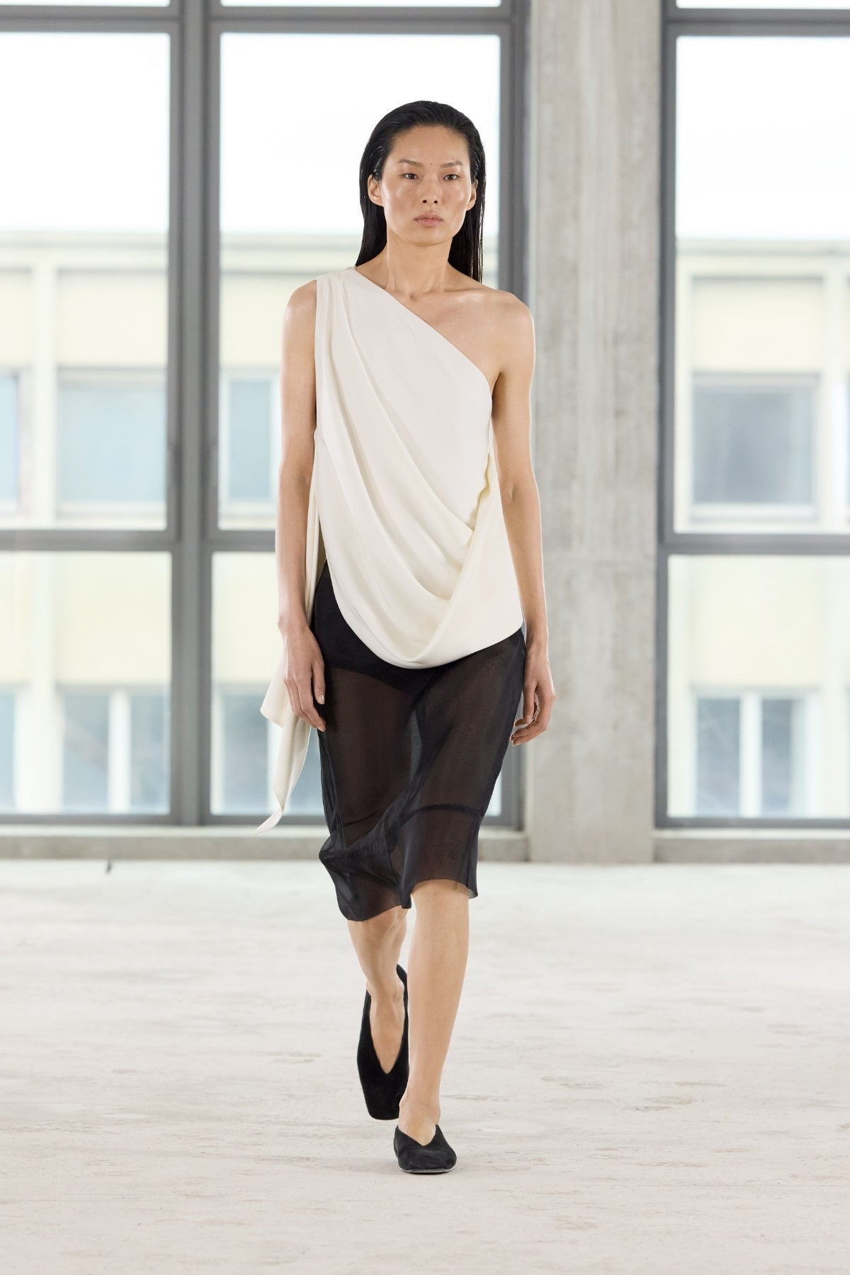 Front runway view CAMILLA AND MARC Eon Top in Cream with a draped asymmetric silhouette.