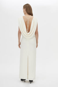 Back view CAMILLA AND MARC Eon Maxi Dress in cream with a draped silhouette and low cowl beaded detailing back.
